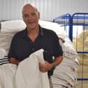 Devon Duvets owners, Dick and Pauline Beijen, with UK’s first British wool duvet made using wool from a Rare Breed sheep. Picture: Henrietta Lilley
