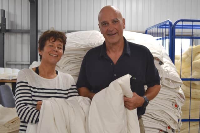 Devon Duvets owners, Dick and Pauline Beijen, with UK’s first British wool duvet made using wool from a Rare Breed sheep. Picture: Henrietta Lilley