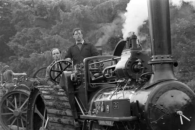 Pictured in late July 1980 is Terry Connelly of Coleraine who is seen getting his 1934 Marshall steamed up at the Ulster Steam Traction Rally at Shane’s Castle. He is watched by his brother Dennis. The grand old steam engines of long ago proudly showed their paces, some after a long journey from England. Picture: News Letter archives/Darryl Armitage