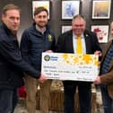 UFU representatives, Glenn Millar, Bartley Finnegan and Gary Anderson present Marie Curie with £1,800 following Fork Supper event in January.