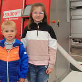 Harris and Ella Kennedy from Ballymena were among the first visitors to see the 50,000th Lely Astronaut robot at Balmoral Show. (Picture: Julie Hazelton)