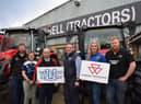 Farm machinery brand Massey Ferguson is once again supporting the YFCU as principal sponsor of their AGM and conference. Pictured: Samuel Bell from William Bell Tractors Ltd (centre left) and YFCU president, Peter Alexander (centre right) with YFCU members.