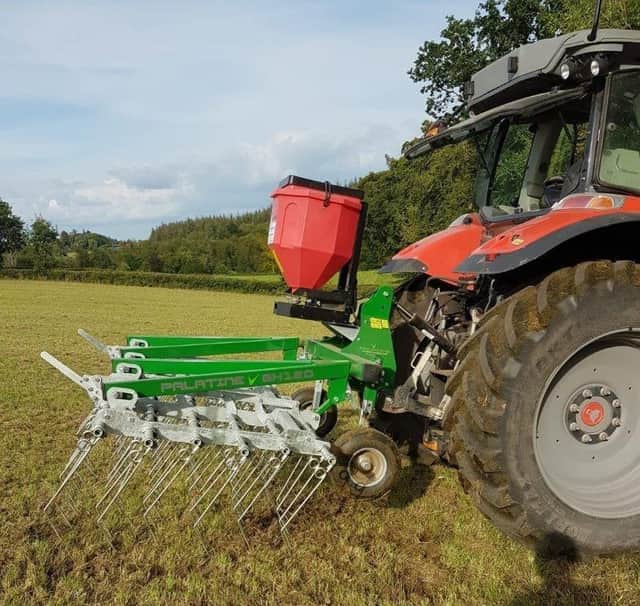 A Grass Harrow with seed broadcaster being used on the farm of an Environmental BDG member to stitch in white clover.