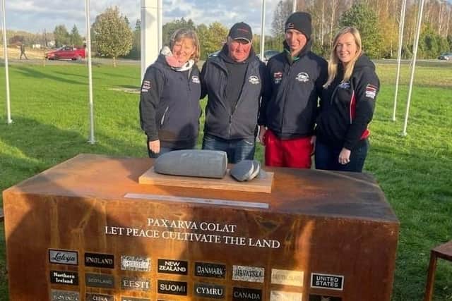 From left to right, Fiona Gill, William Gill, Andrew Gill and his fiancée, Ashleigh Coyle, pictured at the Cairn of Peace, at the World Ploughing Contest in Latvia, last month.
