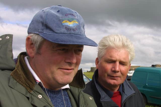 Seamus Gallaher and JP McFadden watch the action at the trials at the Downhill Sheepdog Trials which were held at Downhill Castle at the start of July 2002. Picture: News Letter archives/Kevin McAuley