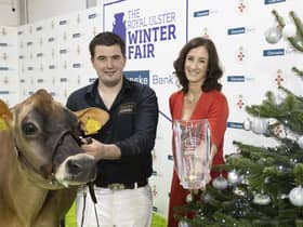 Champion of champions! A delighted Lindsay Fleming and his Supreme Interbreed Champion, Potterswalls Chrome Glamour, pictured with Debbie Reid, Danske Bank who added hrer congratulations in honour of this success. PICTURE KEVIN MCAULEY/MCAULEY MULTIMEDIA