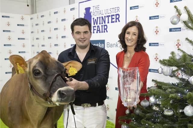 Champion of champions! A delighted Lindsay Fleming and his Supreme Interbreed Champion, Potterswalls Chrome Glamour, pictured with Debbie Reid, Danske Bank who added hrer congratulations in honour of this success. PICTURE KEVIN MCAULEY/MCAULEY MULTIMEDIA