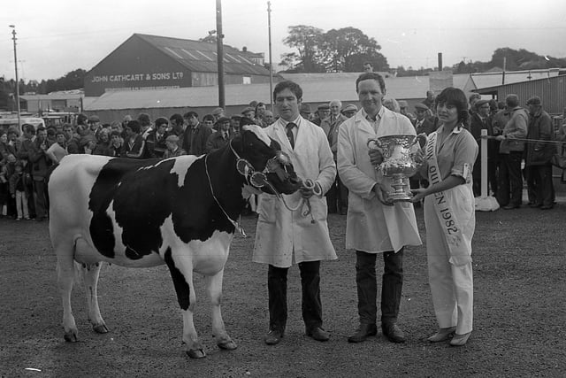 Elizabeth Nassar from Nazareth, Israel, the show queen for 1982, presents the All-Ireland Dairy Cow Championship Trophy to Mr Herbie Crawford of Maguiresbridge, at the Enniskillen (Fermanagh) Show in August 1982. Picture: Farming Life/News Letter archives