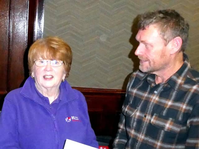 Alan McAteer hands over a cheque to Muriel Barr of the NI Children's Hospice 'Jingle All The Way' Group from Ballymena. Picture: Alan Hall