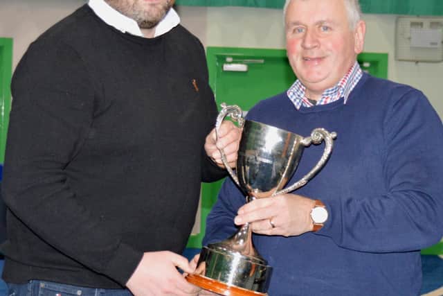 James Wilkinson accepting the Young Breeders Trophy from Nigel Hamill, President of the Young Breeders Club. (NI Texel Sheep Breeders' Club)