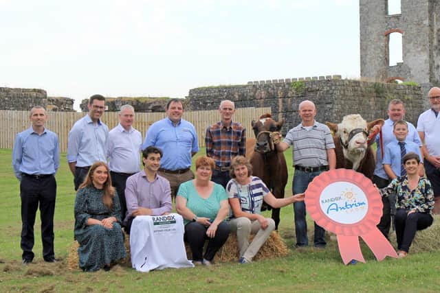 Pictured are sponsors and directors of the Randox Antrim Show’s Cattle sections (back, l-r) Peter Whiteside, Danske Bank; Phillip Moore, Moores Animal Feeds; Seamus McCormick, Danske Bank; Alan Boyd, United Feeds; Trevor Smith; John Suffern with his Ayrshire; William and Lewis Dodd with their Simmental; Alastair Hall, Ernest Hall Menswear; William Graham; (front) Jordan Doherty and Marc Coppez, Randox Health; Linda Davis, Laurel View Farm; Joanie Gilliland; Sarah McCoy, Ulster Bank; and Ryan Godfrey and Matthew Cunning, Fane Valley. Photo: Julie Hazelton.
