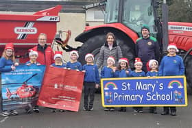 Barry Barnes (Air Ambulance NI), Sinead McGovern (PTFA), Paul Eakin (Clogher Valley Rugby Club) and children from St Mary's