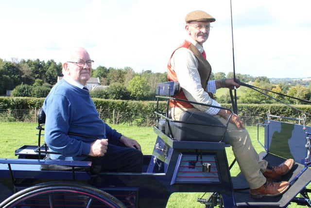 Mervyn Ward gives Windsor Toal a spin on his horse  coach at the vintage Rally. Pic: Billy Maxwell