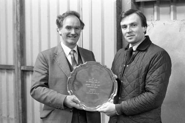 Pictured in November 1982 is Mervyn Porter, Moira, being presented with the Charolais championship salver by Mr David Meharg of John Thompsons and Sons Ltd, at a Charolais breed show and sale which was held at Portadown. Picture: Farming Life/News Letter archives