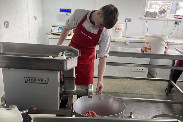 Jacon Neill processing the trim through the mincer for sausages.