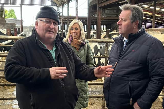 Waringstown dairy farmer Charlie Weir in discussion with DEFRA Minister Mark Spencer and MP Carla Lockhart.