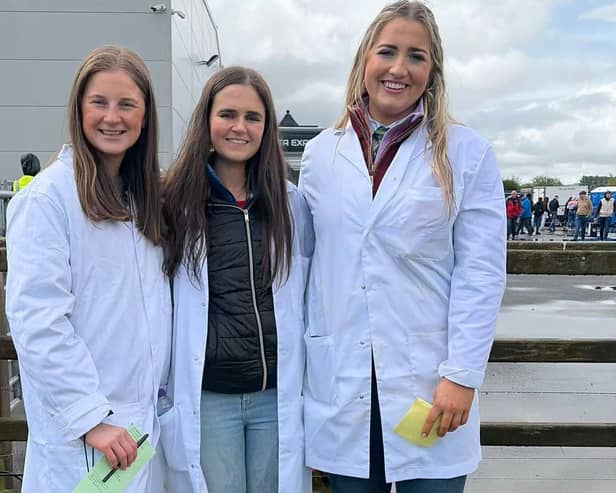 Sophie McAllister, Claire Adams and Alexis Kidd kitted out in their white coats for a busy morning of stock judging. Picture: Lisnamurrican YFC