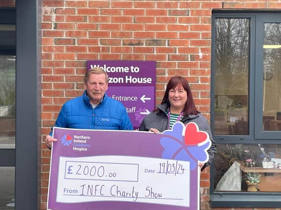 Noel Higginson proudly displaying one of the Cheques from the I.N.F.C. Charity Show