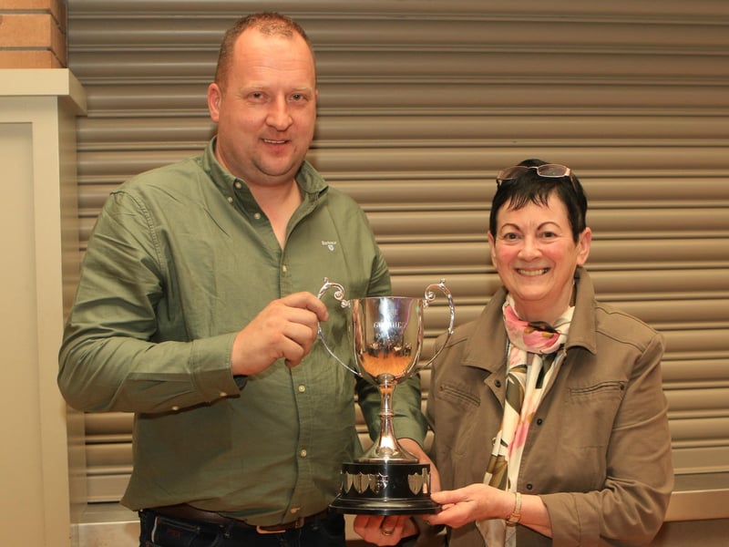 Jonny Hazelton receiving the Guinness Cup for the Overall Champion with Ranfurly Lady Diana 41st from Ruth Montgomery, Clogher Show secretary.