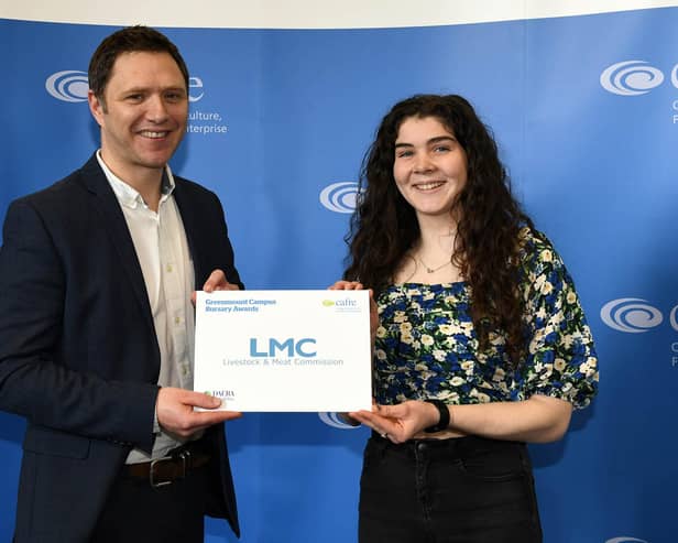 LMC chief executive Colin Smith pictured awarding the LMC bursary to student Laura Geddis.
