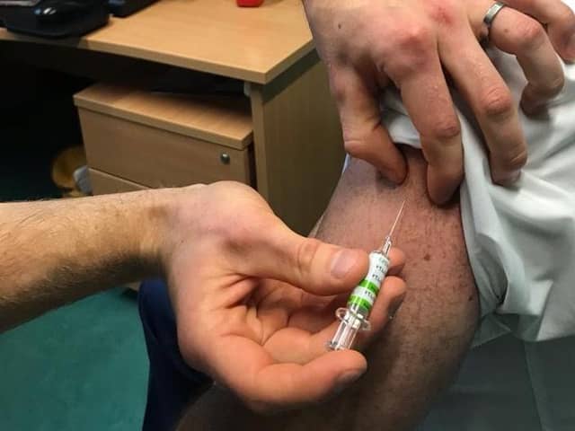 Chief Medical Officer, Professor Sir Michael McBride receiving his vaccination.