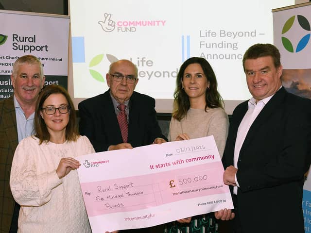 Nula and Judith from the National Lottery Community Fund presenting a cheque to Kevin Dogerty, CEO at Rural Support and Life Beyond committee members