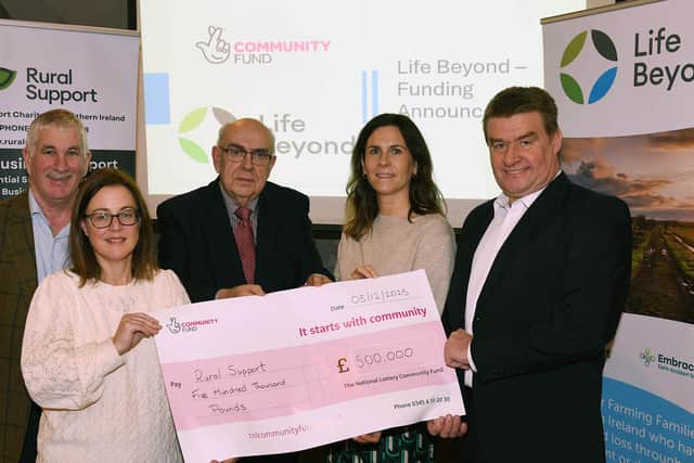 Nula and Judith from the National Lottery Community Fund presenting a cheque to Kevin Dogerty, CEO at Rural Support and Life Beyond committee members