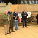 Alan McKee who is presenting the Clarence McKee memorial cup to Dermot McCusker who won overall champion along with first place in the heifer class. Also pictured are mart manager John Farnon and judge Keith Tumilty. Picture: Hilltown Mart