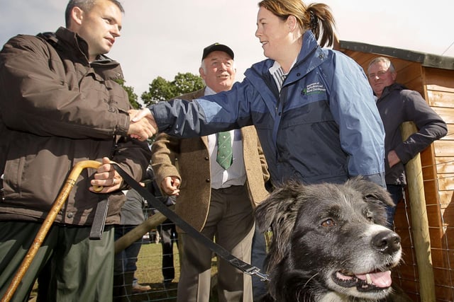 Agriculture Minister Michelle Gildernew meets Donegal dog handler Seamus Robinson and his sheepdog Rodge at the international sheepdog trials at Massereene Farm, Antrim, in the company of Irish National Sheepdog Society president Eric Barefoot. Picture: Farming Life archives