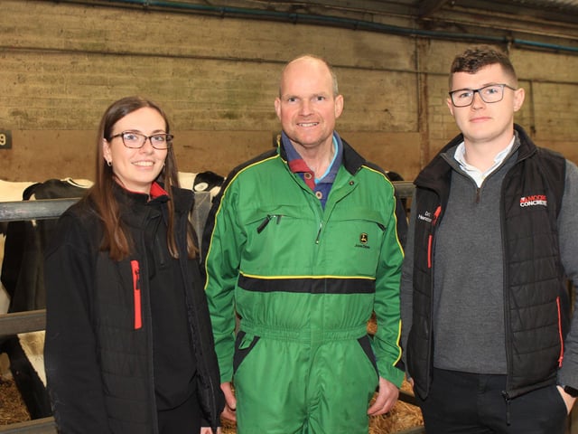 Banbridge dairy farmer George Mitchell pictured at the Dunganon Dairy Sale with sponsors Maeve Birt and David Henderson, Moore Concrete. Picture: Julie Hazelton