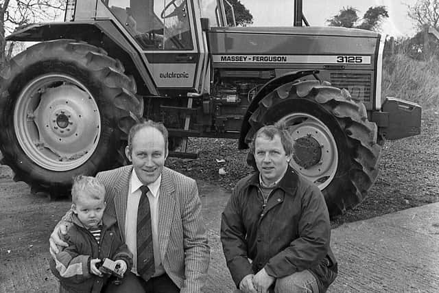 Pictured in January 1992 is Trevor Cander, agricultural director of Cyril Johnston and Company Ltd, with Robert and William Brown of Ballygillan Hill, Coagh. The Browns had recently purchased a new MF3125 four-well drive and a MF3095 four-wheel drive, “one of 1991s best sellers”, from Cyril Johnston and Company Ltd. Picture: Farming Life/News Letter archives