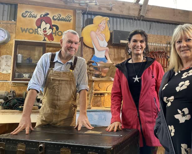 Presenter Lolly Spence (centre) with furniture restorer Brian Bailie and steamer trunk owner Susie Millar during filming for Oul Treasures, coming to BBC One Northern Ireland, Monday 25 March at 10.40pm. The entire series will be available to watch on BBC iPlayer from March 25