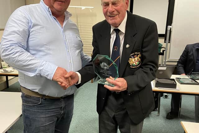 William Gill (left), Listooder Ploughing Society, receiving a plaque from Northern Ireland Ploughing Association Patron, Don Wright, in recognition of him winning the European Vintage Ploughing Championships in Netherlands.