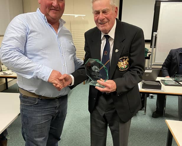 William Gill (left), Listooder Ploughing Society, receiving a plaque from Northern Ireland Ploughing Association Patron, Don Wright, in recognition of him winning the European Vintage Ploughing Championships in Netherlands.