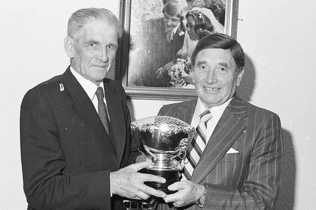 Pictured in October 1982 at the Mounthill Fair Society dinner and prize distribution at Kilwaughter is Mr William Warren, MBE, editor, presenting the Farming Life Trophy to Mr William Moore, chairman of Mounthill Fair Society, for competition in the Tiny Tots Leading Rein class at the fair. Picture: Farming Life/News Letter archives