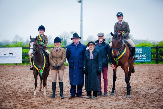 Supreme Champion, Taylor Lee Doyle and Telynau Darwin (left); Reserve Supreme, Eva Lowry and Glenveagh Viewpoint (Right); and judges, from left to right, Katie Crozier, Ernie Somerville, Jane Somerville and Brian Murphy. (Pic: Black Horse Photography)