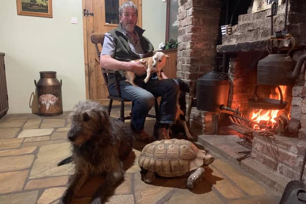 Kenny Gracey from Forthill Farm, near Tandragee in County Armagh, relaxes in front of the fire. Kenny features in The Chronicles Of Armagh, beginning on BBC One Northern Ireland on Monday 19 February at 8pm. The entire series will also be available to view on BBC iPlayer. (Pic: BBC)