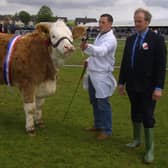 Frank Kelly from Tempo with his champion Simmental cow with judge David Bell at the Ballymena Show in 2002. Picture: Farming Life archives/Kevin McAuley