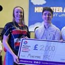 Sian Hogg, club treasurer and Jack Hunter, club leader, presenting cheque from Children’s Hospice Northern Ireland representative. Picture: Moneymore YFC