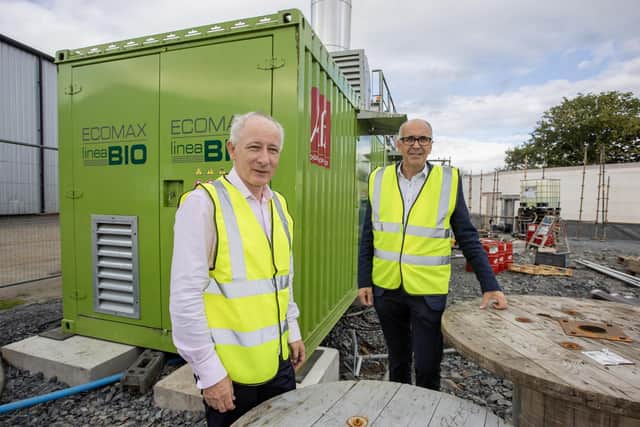 Wilson's County managing director, Lewis Cunningham, and company chairman, Angus Wilson, inspecting the combined heat and power engine, which will be at the heart of the potato operation's new anaerobic digestion plant. Pic: McAuley Multimedia