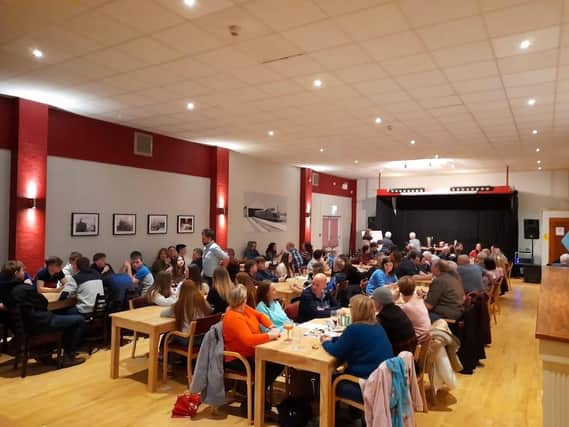 Members with their family and friends competing in the quiz