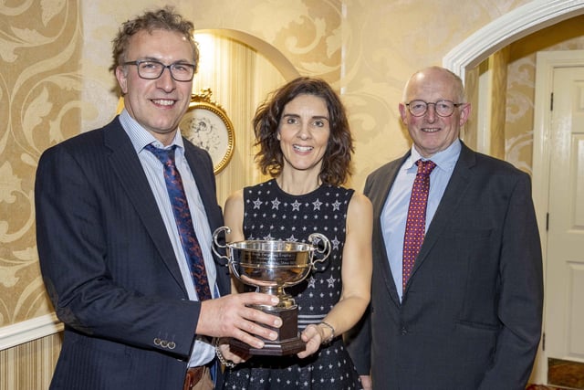 The Ulster Bank Trophy for the champion at the November (2021) Dungannon Dairy Sale was won by Richard and Rachel Trimble, Kircubbin. They received the silverware from Holstein UK chairman Michael Smale. Picture: Kevin McAuley/McAuley Multimedia