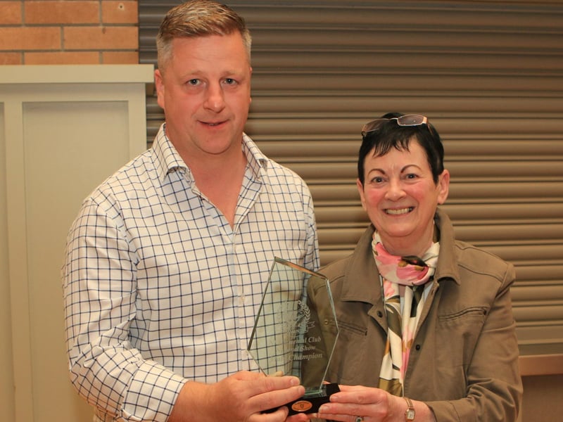 Ruth Montgomery, Clogher Valley Show secretary, presenting the Male Champion Crystal to Neil McIlwaine for Corrick Spartan.