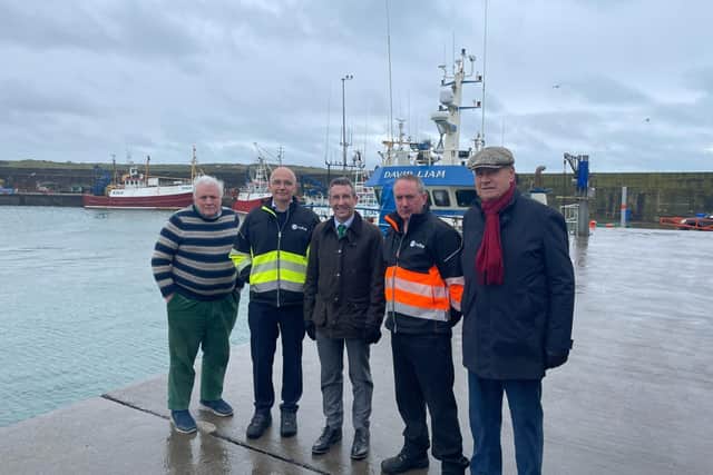 DAERA Minister Andrew Muir is pictured on a visit to Ardglass harbour with Dick James from the Ardglass Harbour Development Group, Kevin Quigley, CEO of the Northern Ireland Fishery Harbour Authority, Ardglass Harbour Master James Lenaghan and Comgall Milligan, Chair of the Ardglass Harbour Development Group. (Pic: DAERA)