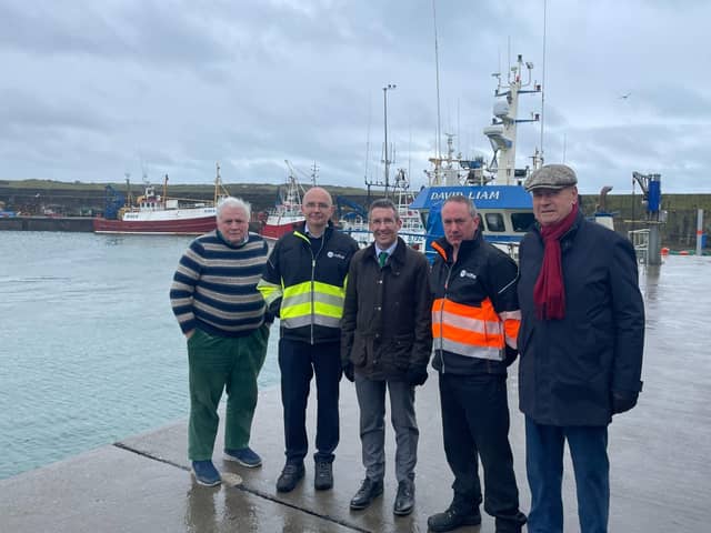 DAERA Minister Andrew Muir is pictured on a visit to Ardglass harbour with Dick James from the Ardglass Harbour Development Group, Kevin Quigley, CEO of the Northern Ireland Fishery Harbour Authority, Ardglass Harbour Master James Lenaghan and Comgall Milligan, Chair of the Ardglass Harbour Development Group. (Pic: DAERA)