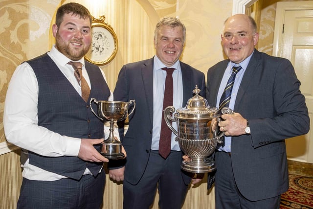 Alex Walker, centre, chairman Holstein NI, congratulates Iain and John McLean, Priestland Herd, Bushmills, who collected a number of awards at the club’s annual dinner in Ballymena. Picture: Kevin McAuley/McAuley Multimedia