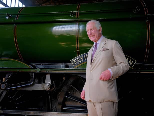 King Charles in front of The Flying Scotsman at Pickering Station