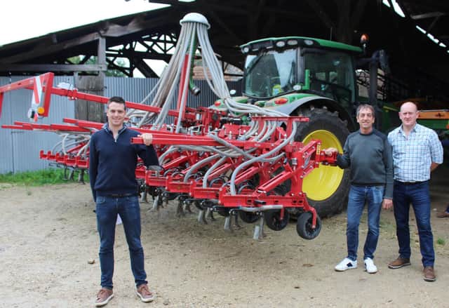 Arnaud and Jean Cristoph Rousselat demonstrate their combined mechanical weeder and seed drill to Lemken's Derek Delahunty (right)
