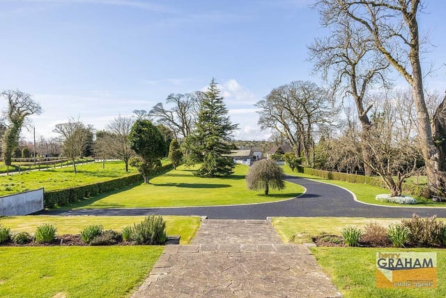 The gardens and outside areas, extending to approximately two acres, include an extensive garden laid in lawn with mature trees. Image: www.hgraham.co.uk