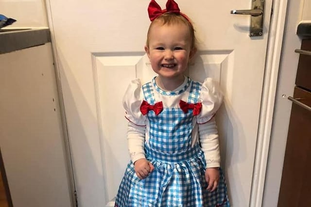 Two-year-old Evah Merrills will be following the yellow brick road as she dressed up as Dorothy from The Wonderful Wizard of Oz, originally published in 1900.